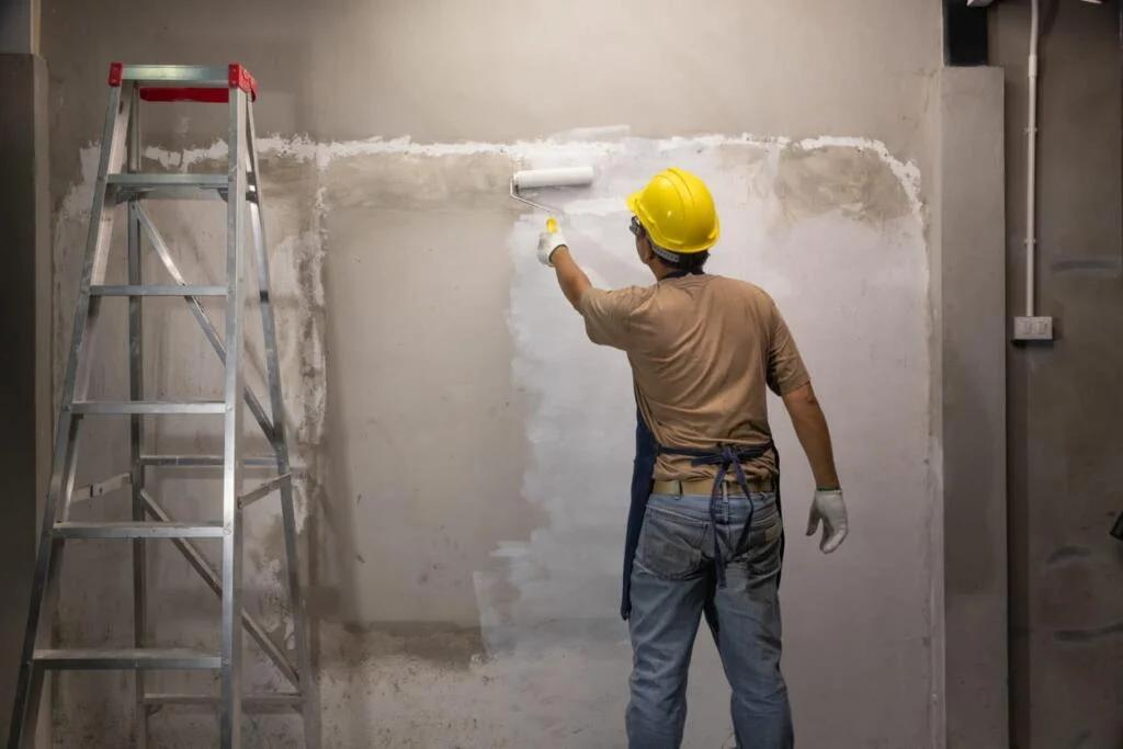 Painter working on a wall